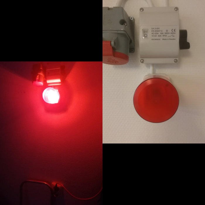 Eluttag och strömbrytare på vägg med en tänd röd lampa och en nödstoppknapp.