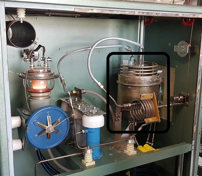 Industriellt värmesystem med inringad del som visar impedansanpassning, likt diskuterat handtag.