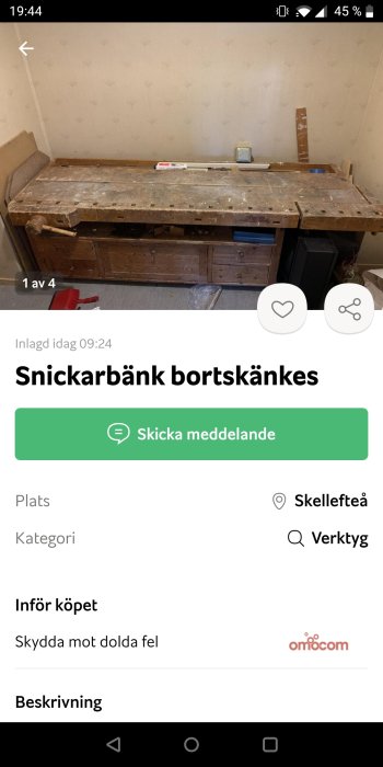 Använd snickarbänk i ett rum, verktyg och lådor synliga, bänk i begagnat skick.