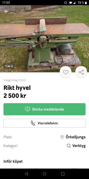 Begagnad grönmålad hyvelbänk utställd på gräs för försäljning.