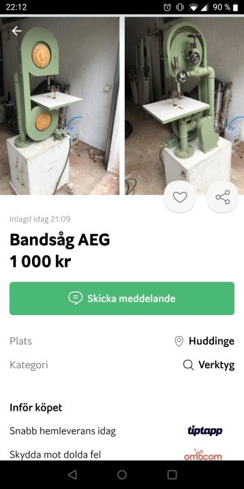 Hemmabyggd vertikal bandsåg i grönt med trädetaljer, står i ett garage.