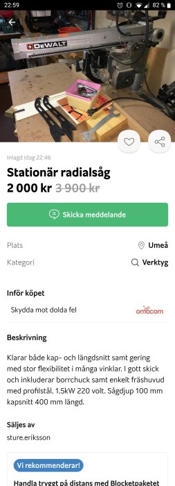 Stationär DEWALT radiälsåg i ett verkstadsutrymme med tillbehör och verktyg på arbetsbänken.