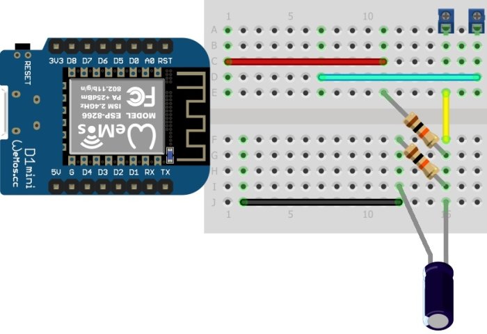 Wemos D1 Mini kopplad till en breadboard med motstånd och kondensator illustrerande en kretsbyggnad.