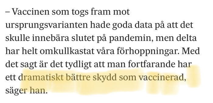 Närbild på en textutdrag med fokus på vaccinets skydd mot ursprungs- och deltavarianterna av viruset.