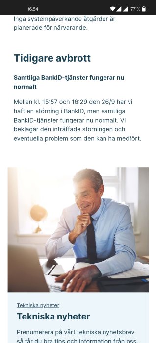 Skärmdump av en teknisk informationssida med text om avbrott i BankID-tjänsterna och en leende man vid en bärbar dator.