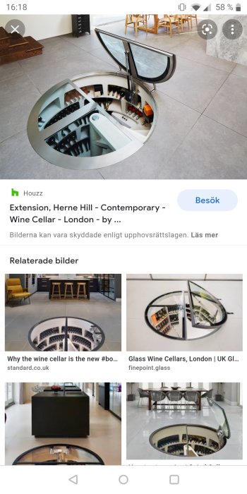 Modernt vinkällarrum med cirkelformad glasöppning i golv och inbyggda vinhyllor.