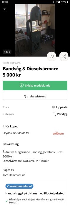 Äldre vertikal bandsåg i ett verkstadsrum framför ett fönster, till salu.