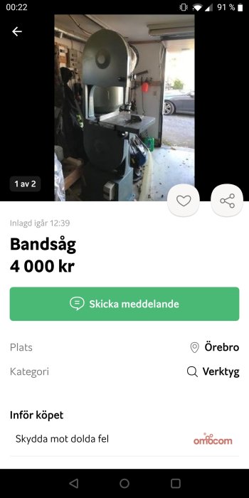 Bandsåg i ett garage till salu, visas på bild i en annons med priset och kontaktinformation.