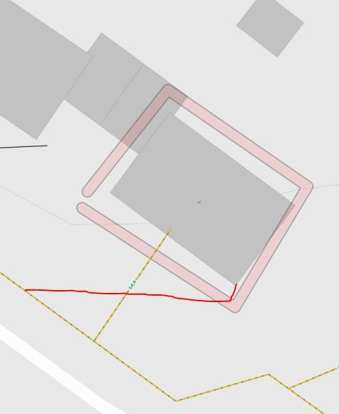 Schematisk bild av gräns för tomt och misstänkt sträckning av en abonnentledning nära en byggnad.