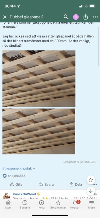 Wooden slatted ceiling under construction, slats installed in a double cross pattern with visible plastic sheeting.