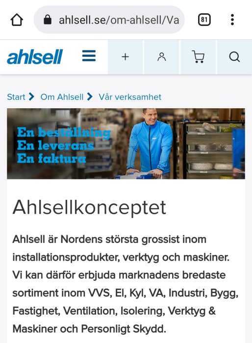 Webbsideskärmdump av Ahlsell med en man i blå arbetskläder i ett lager.