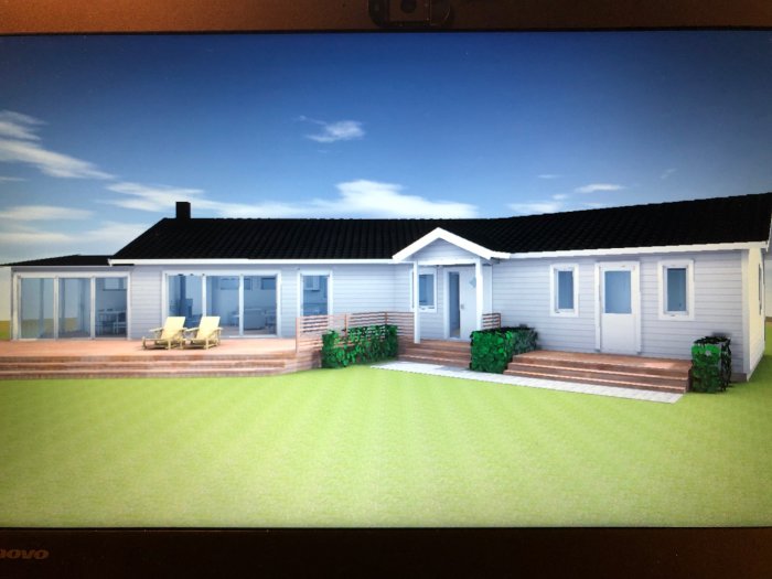 3D-visualisering av enplanshus med terrass, gräsmatta och två solstolar.