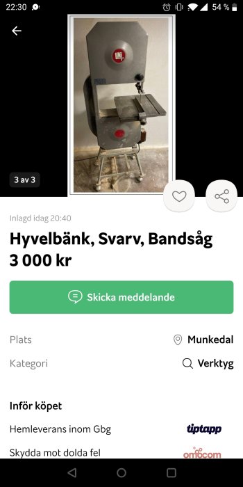 Begagnad bandsåg i metall med märkningen 'INCA' på grått hölje, står i ett verkstadsutrymme.