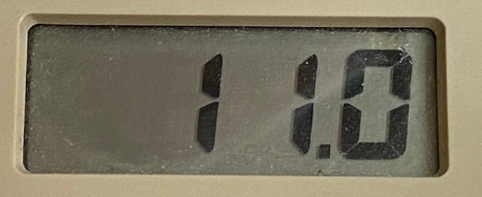 Digital display showing "0.11" presumably indicating the measured standby current of 11 mA from a computer power supply.