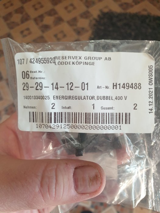 Ny regulator för spis, förpackad, med etikett och artikelnummer H149488 synlig.
