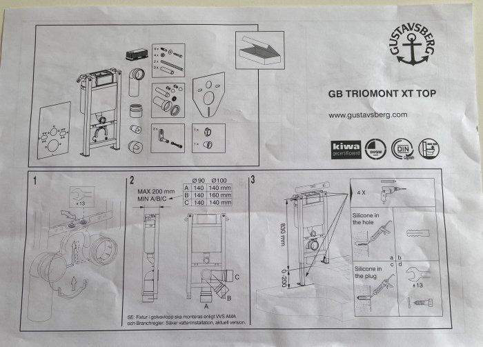 Monteringsanvisning för Gustavsberg Triomont XT toalettfixtur med numrerade delar och installationsguide.