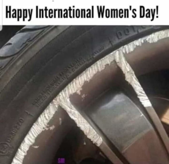 Sliten bildäckshjul med texten "Happy International Women's Day!" överlagrat.