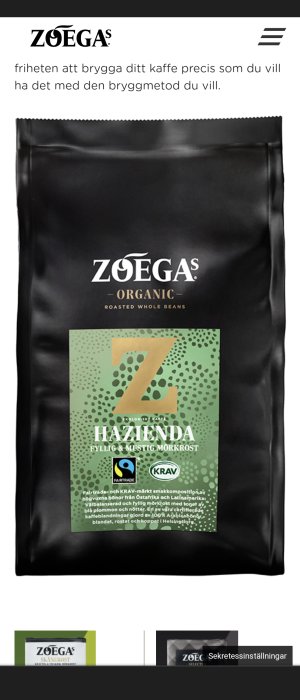 Förpackning av ZOÉGAS Organic Hazienda mörkrost kaffebönor med Fairtrade- och KRAV-märkning.