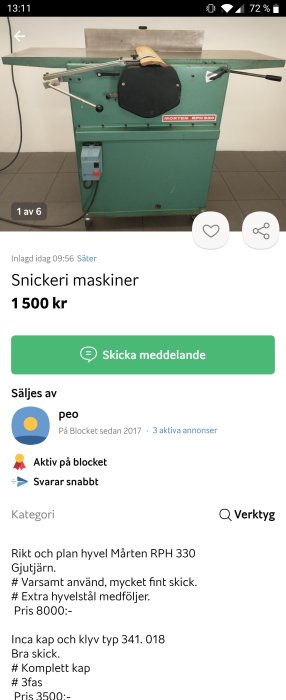 Industriell grönmålad trähyvelmaskin på golvet i en verkstad.