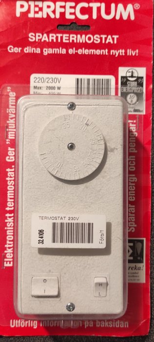 Elektronisk termostat för el-element förpackad i röd blisterförpackning med justeringsratt och produktinformation.