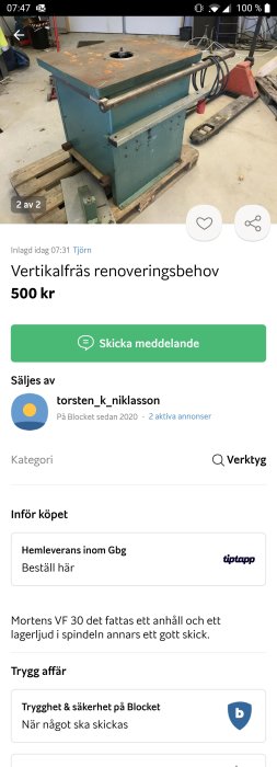 Begagnad vertikalfräs i renoveringsbehov i ett arbetsrum med diverse verktyg i bakgrunden.