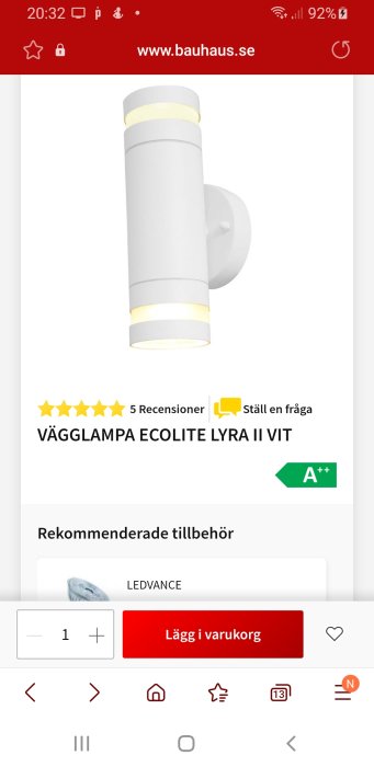 Vit Ecolite Lyra II vägglampa i cilindrisk form med upplyst ring, visad på Bauhaus webbsida med produktrecensioner och energimärkning A++.