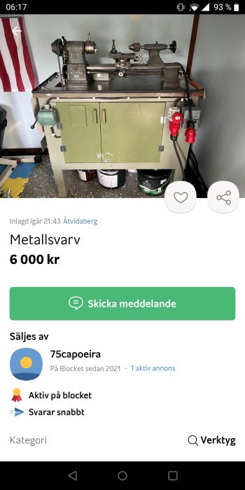 Metallsvärv monterad på grönt skåp, belägen i en verkstad, visas till försäljning online.