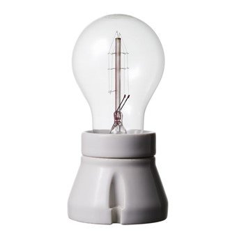 Glödlampa i klassisk stil monterad i en porslinshållare för att matcha historiskt utseende.