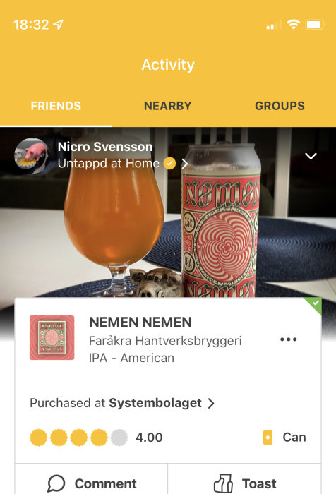 Ölglas fyllt med bärnstensfärgad öl och en färgglad burk märkt "NEMEN NEMEN" från Fåråkra Hantverksbryggeri.