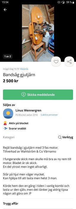 Orange bandsåg i gjutjärn från Wahlström & Co Värnamo placerad i en verkstad.