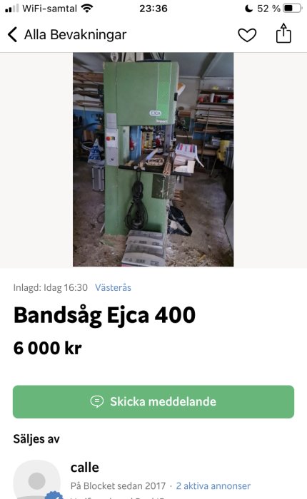 Grön bandsåg Ejca 400 placerad i en verkstad med trähantverksmaterial och verktyg i bakgrunden.