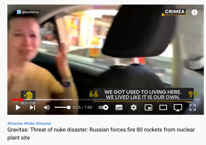 Suddig bild på en ledsen kvinna i bil, videospelarkontroller och text "Threat of nuke disaster: Russian forces fire 80 rockets from nuclear plant site".