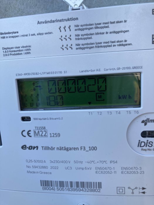 Elmätare med användarinstruktioner och tekniska specifikationer på displaypanel.
