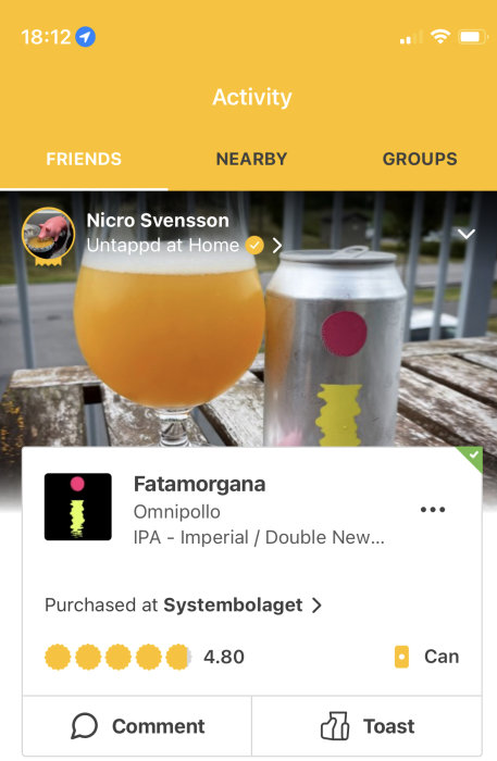 Ölglas med öl bredvid en burk av Fatamorgana IPA från Omnipollo, visar användarbetyg på app.