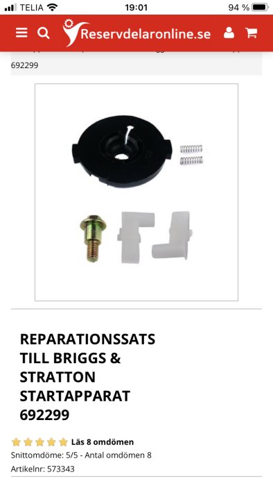 Reparationssats till Briggs & Stratton startapparat med svart ratt, bult, fjädrar och plastdelar.