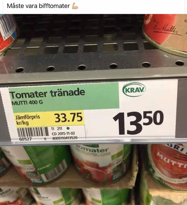 Hyllkant med prislapp för burkar av Mutti tomater, pris på 13:50 kr och jämförpris 33.75 kr/kg, med KRAV-märkning.