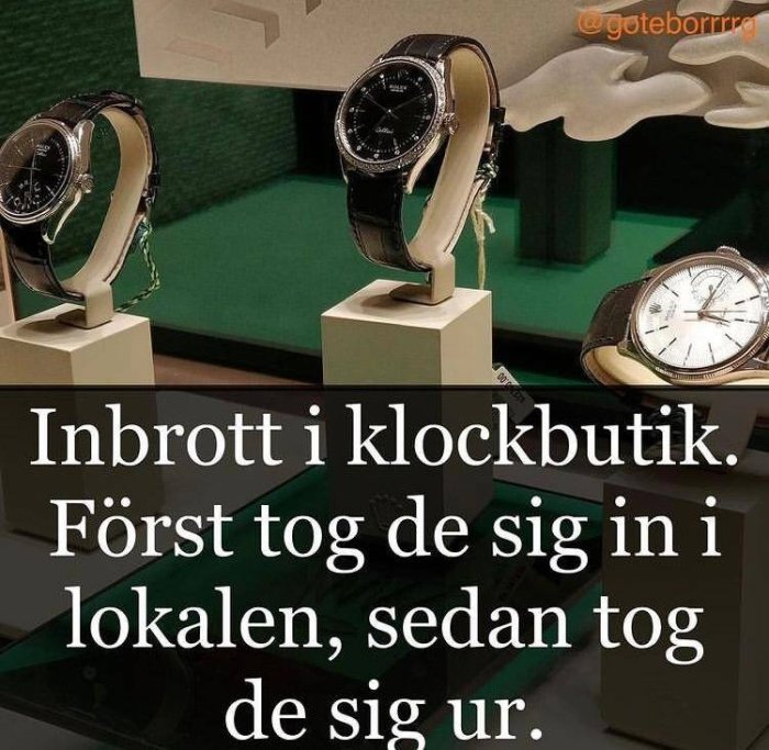 Två armbandsur på display inuti en skadad butik med text om inbrott.