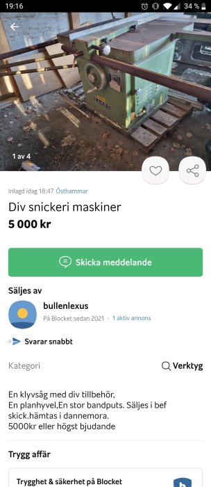 Begagnad grönmålad Kamro klyvsåg till salu, placerad i ett verkstadsutrymme med löv på golvet.