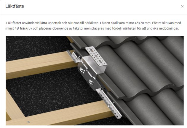 Metallfäste monterat på träläkt som används för att fästa takpannor utan att perforera underlaget.