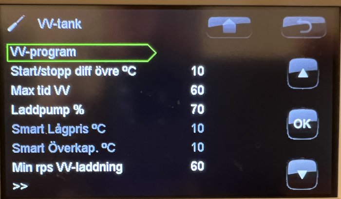 Digital display för värmesystem med inställningar för drift och temperaturkontroll.