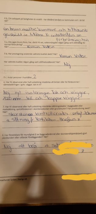 Svensk text, ifylld blankett om fastighetsförhållanden, handskrift, anteckningar, personuppgifter suddade.