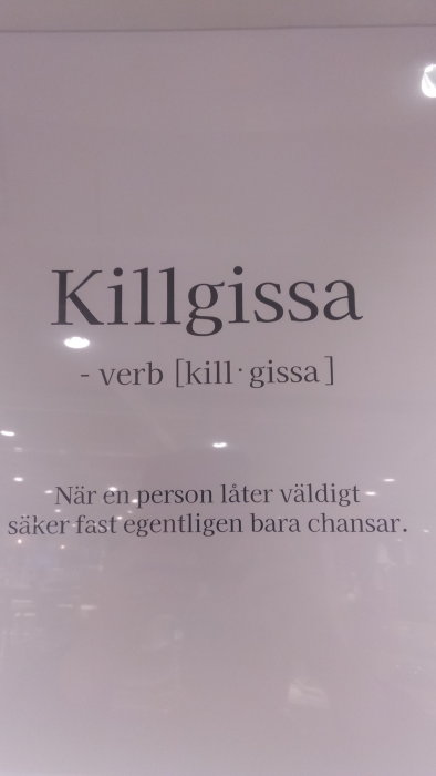 En affisch med ordet "Killgissa", definition på svenska om att verka säker utan att veta.