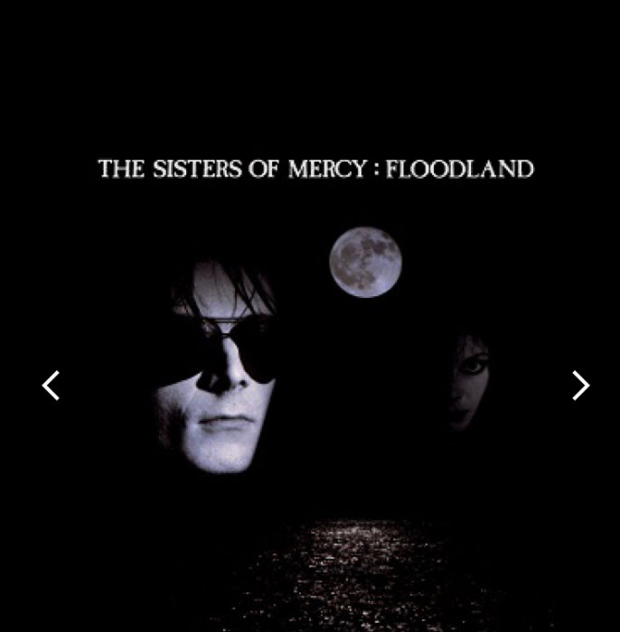 Mörkt albumomslag med två ansikten, måne, vatten och text "The Sisters of Mercy: Floodland".