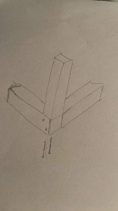 Enkel handritad skiss av ett tredimensionellt objekt som liknar ett kors eller en pil.