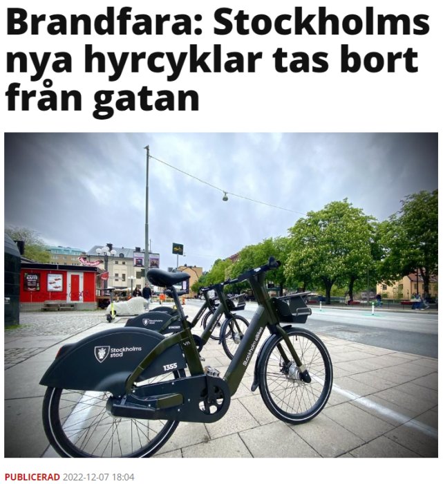 Elcyklar på gata, mörka moln i himlen, stadsmiljö, rubrik om säkerhetsåtgärder i Stockholm, artikel publicerad datum.