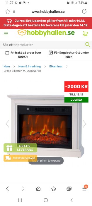 Webbsida visar vit elektrisk kamin med rabatterbjudande, jultema, gratis leverans, och sökfältet.