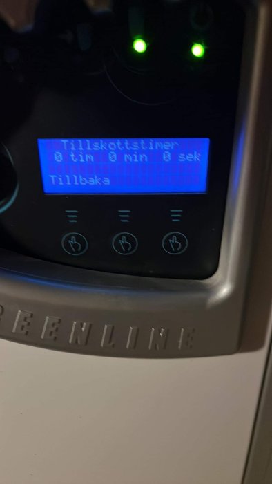 En skärm visar tidsinställningar i minuter och sekunder, med knappar och två gröna lampor ovanför.