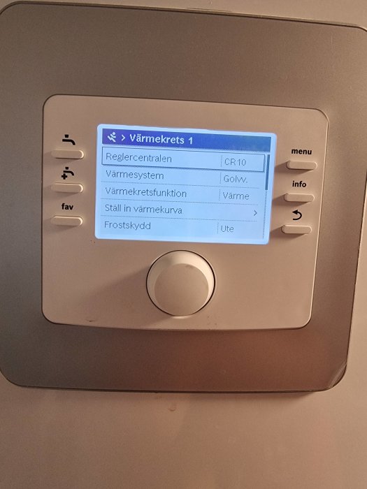 Värmeregulatorpanel med display, knappar, menyalternativ för golvvärme, energieffektivitet och inställningar.