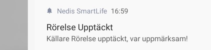 Meddelande från Nedis SmartLife visar rörelsedetektion i källare, uppmanar till uppmärksamhet.