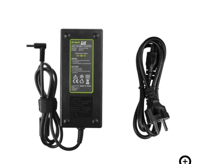Svart strömadapter med märkningen "Green Cell", kablar och EU-kontakt.